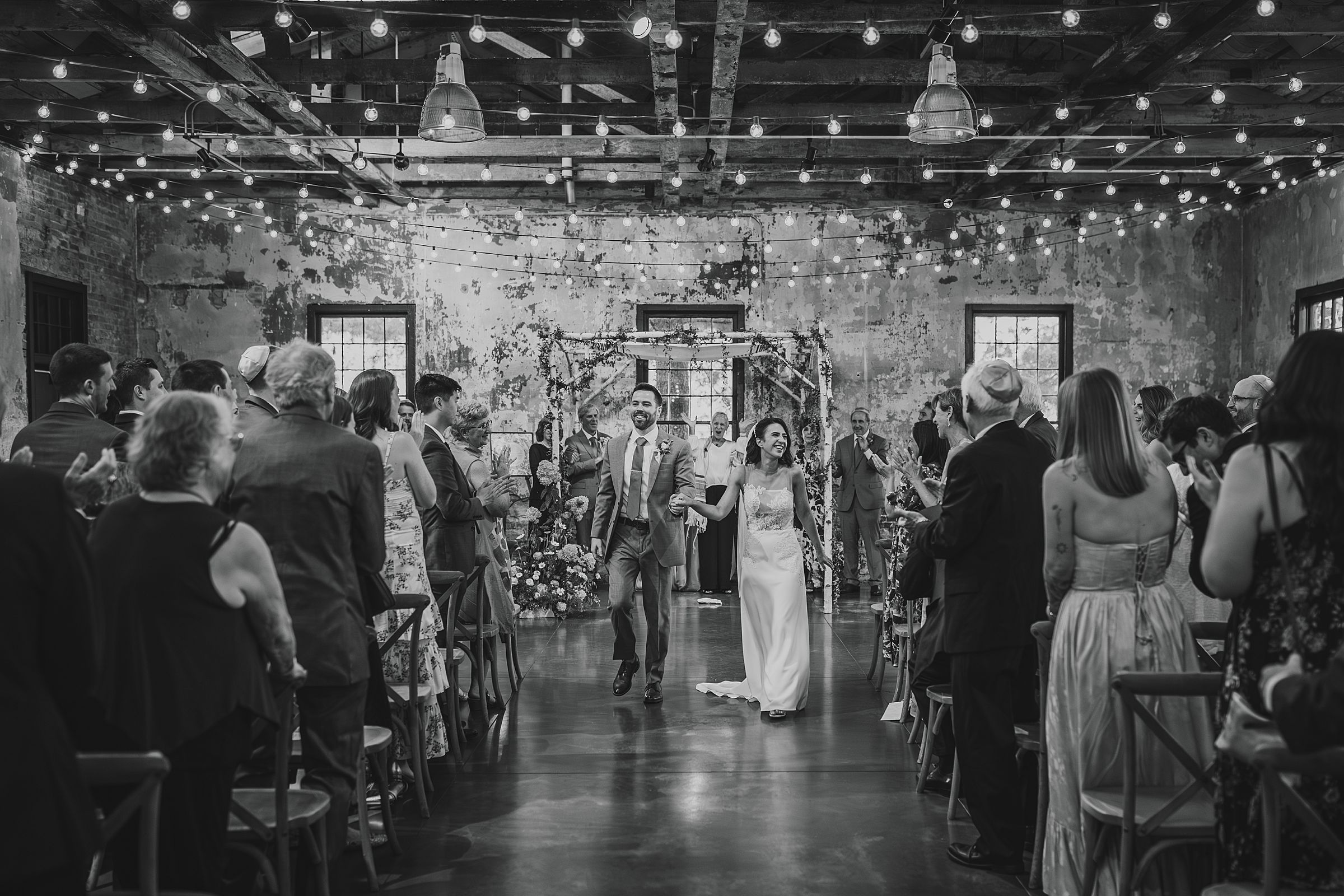 a bride and groom moments after their first kiss at the Mt. Washington Mill Dye House.