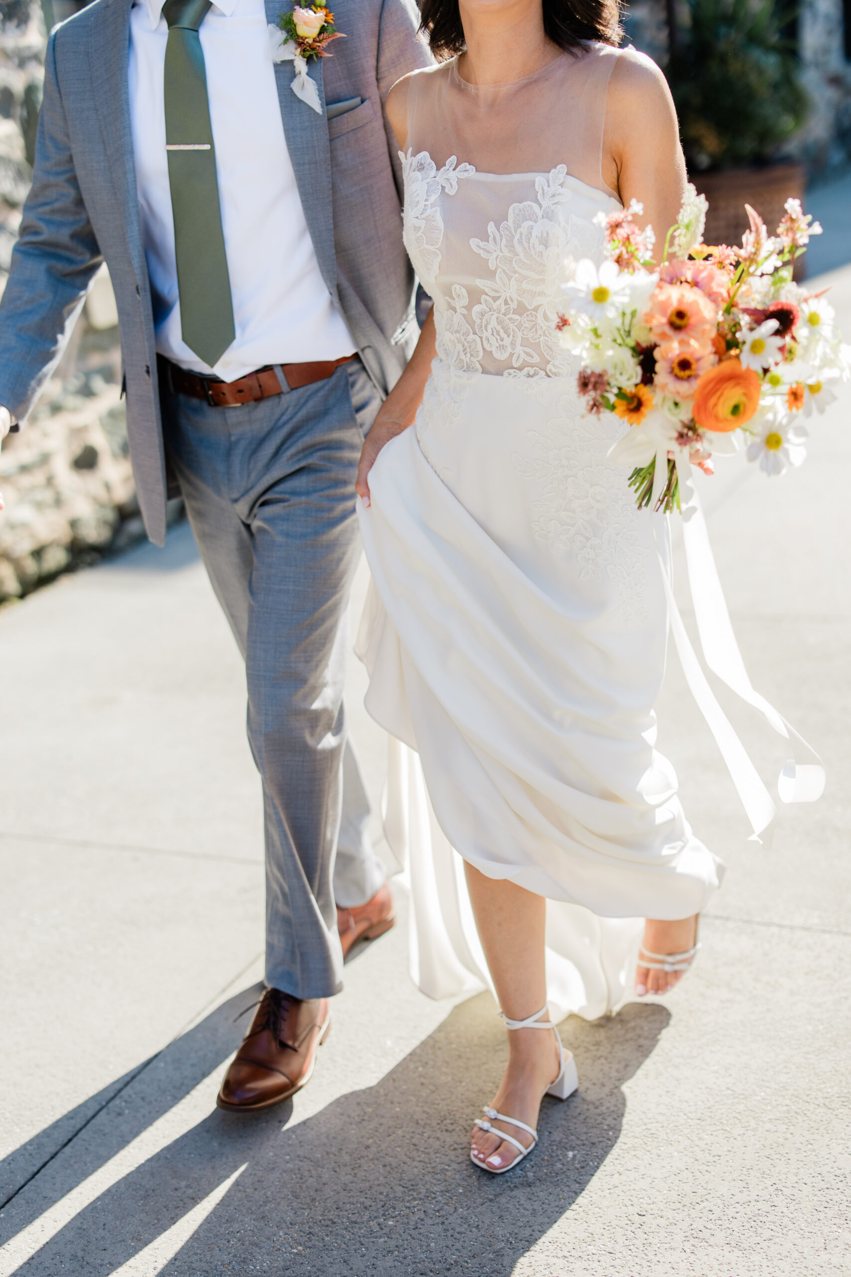 Bride and groom walking during wedding at the mt. washington mill dye house