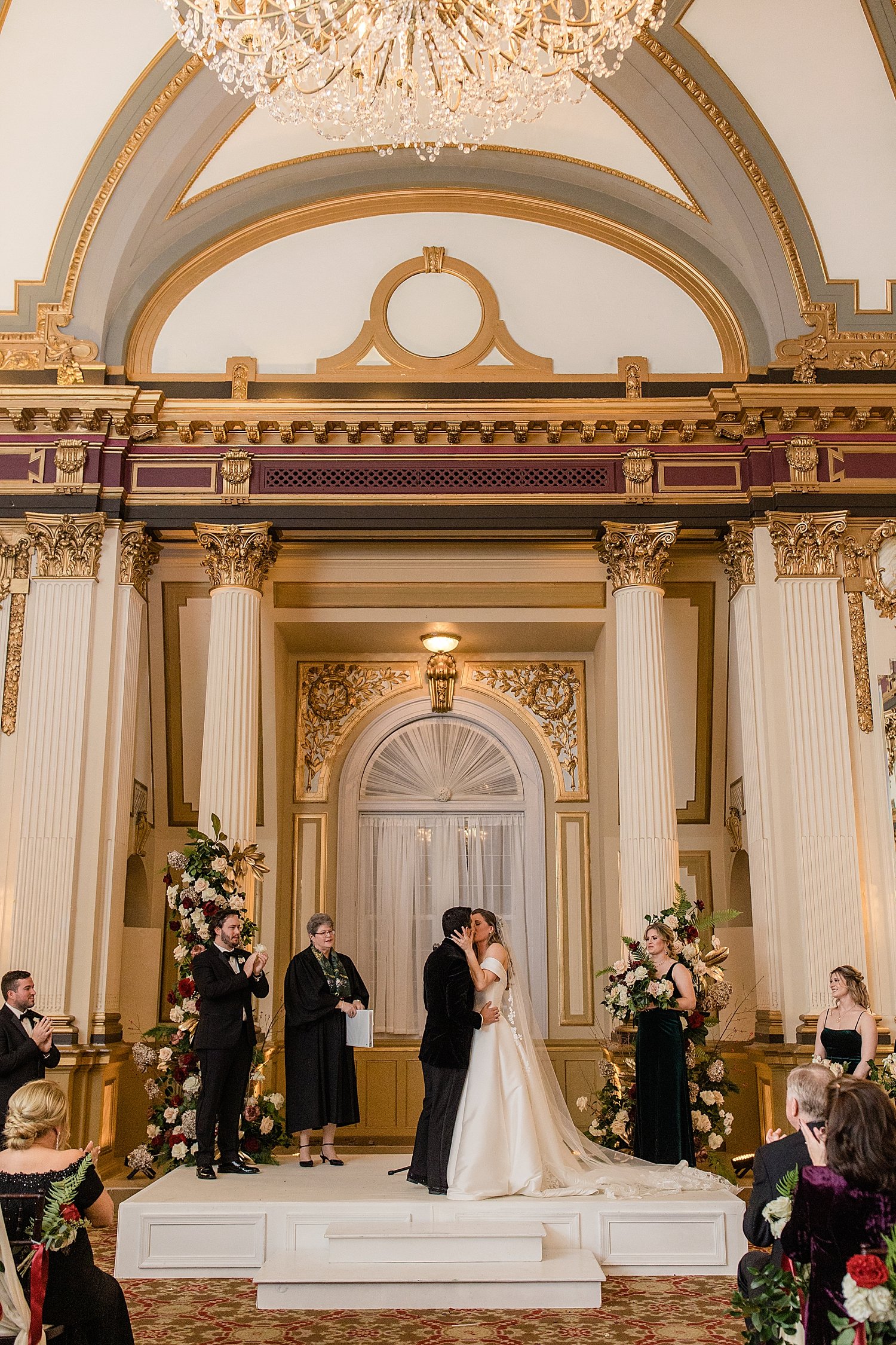 newlyweds share first kiss at the alter at The Belvedere