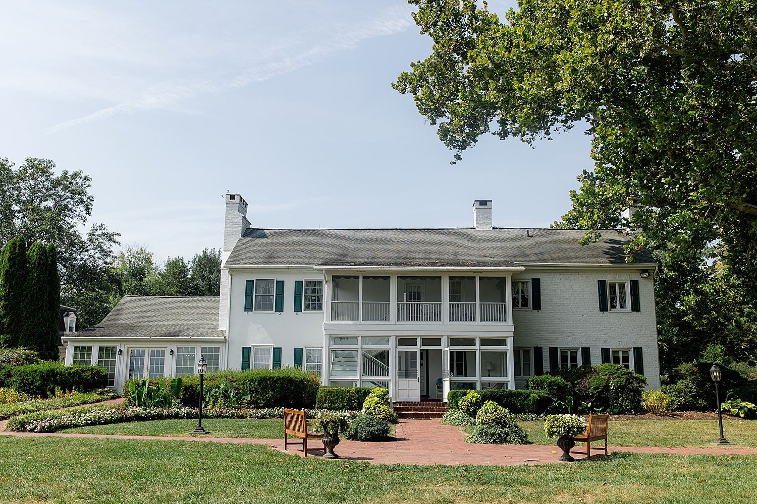 beautiful house with sprawling green lawn at Swan Harbor