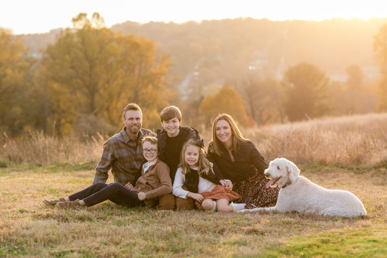 family neutral outfits and soft fall colors during golden hour