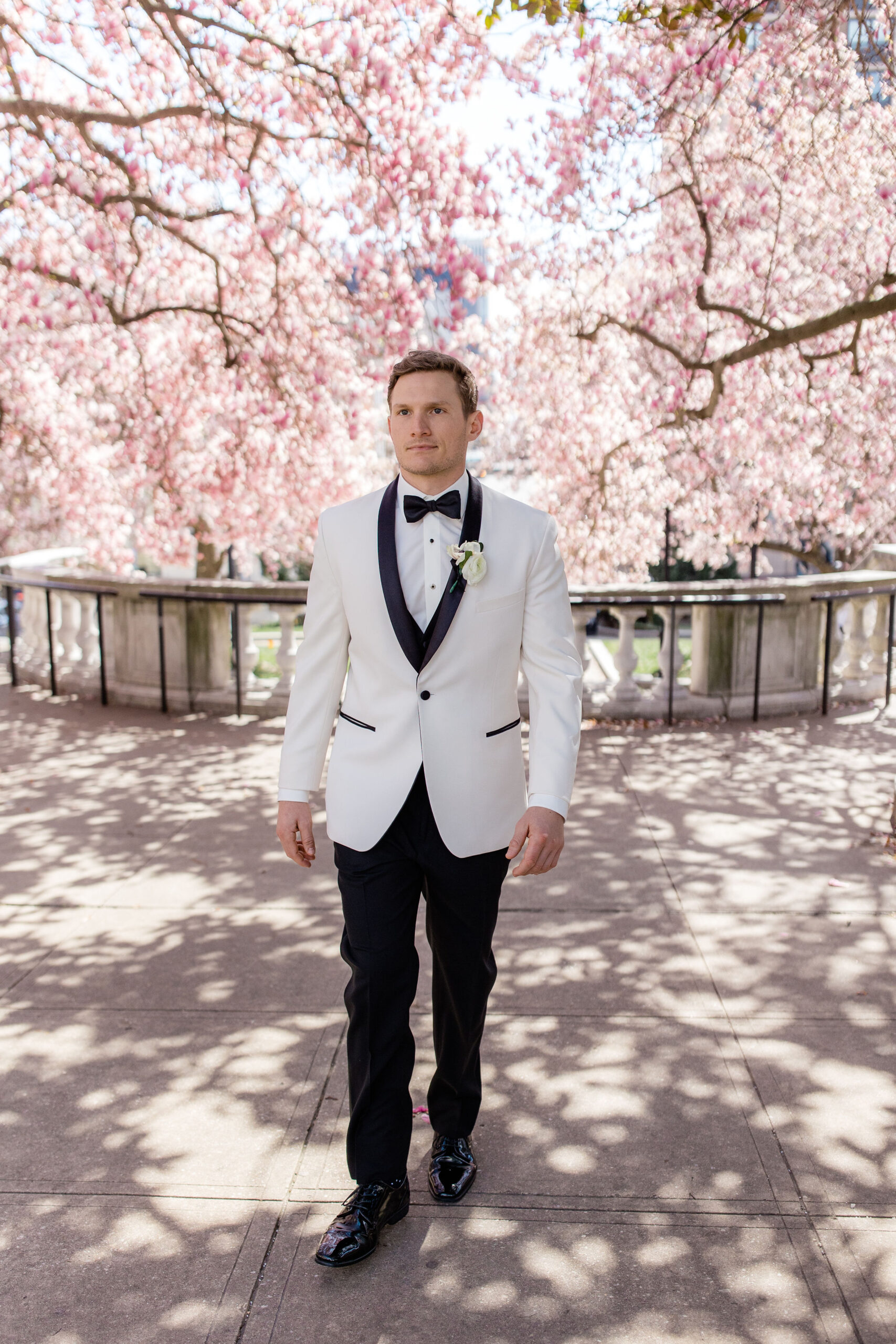 Spring photoshoot locations Baltimore groom portrait under blooming trees