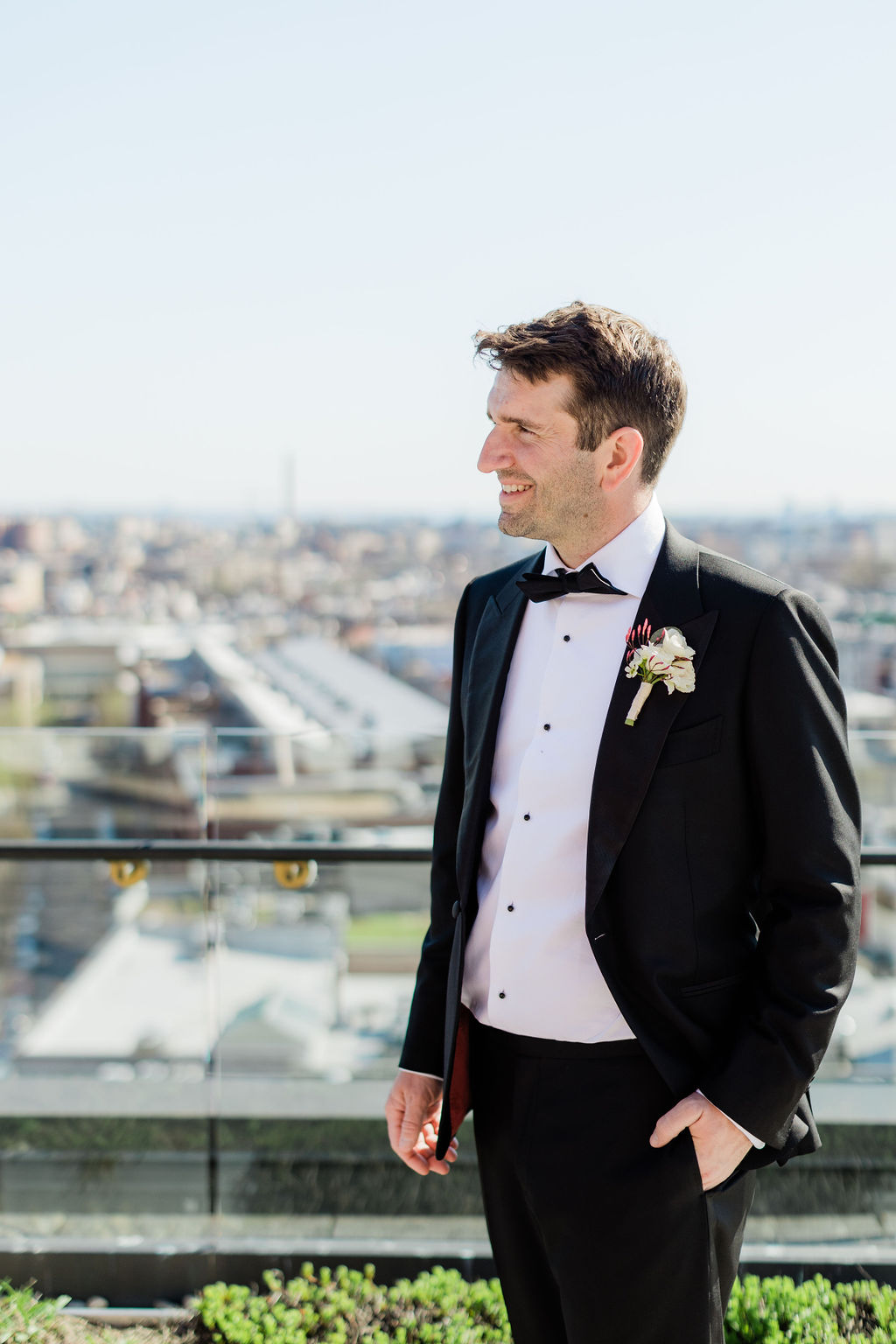 groom portrait overlooking awashington dc skyline