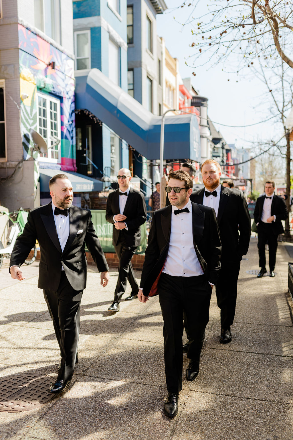 groomsmen walking through adams morgan neighborhood before a DC wedding