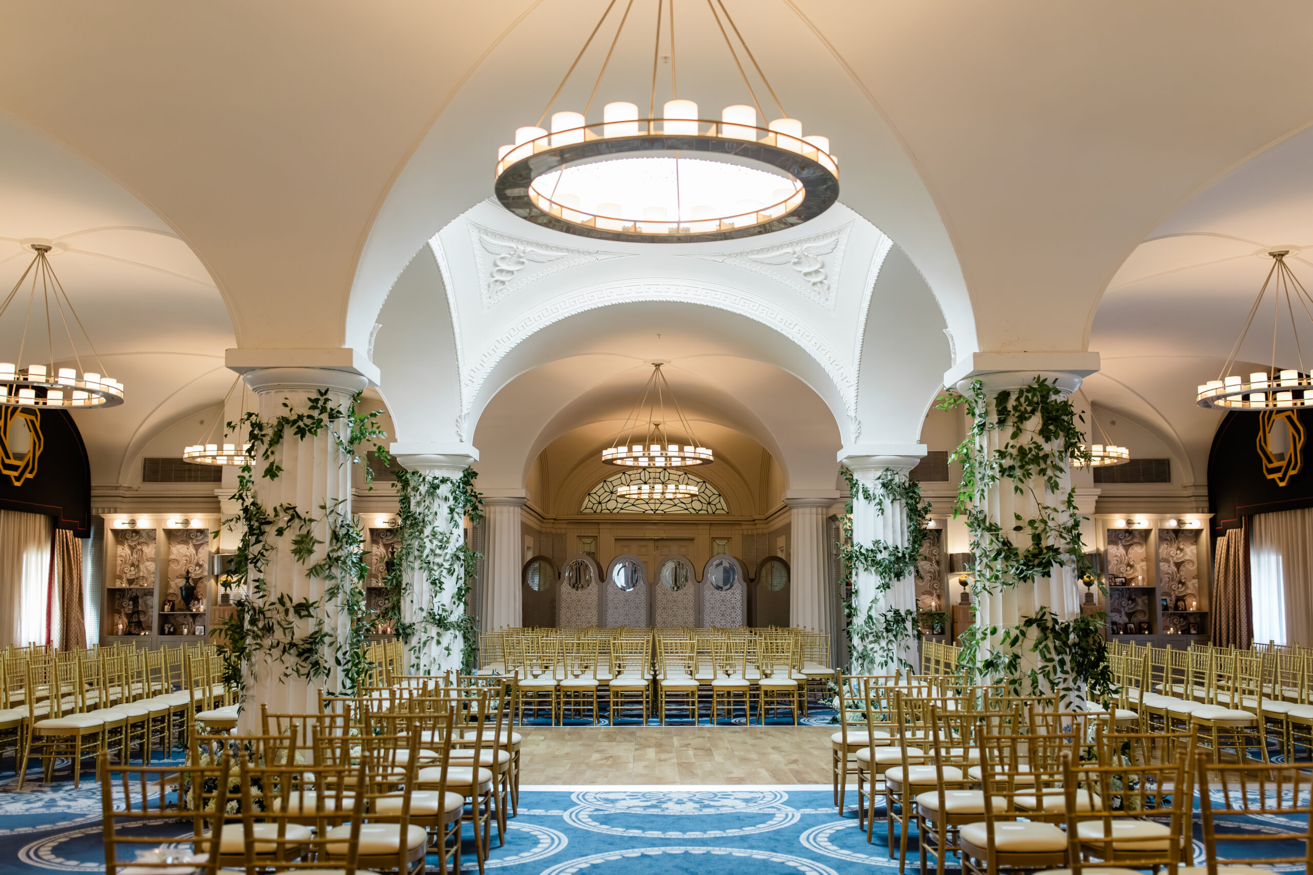 hotel monaco washington ceremony space wide view with chandeliers and ivy wrapped columns