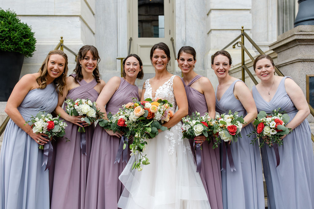 hotel monaco washington wedding bridesmaids portraits on steps with colorful bouquets