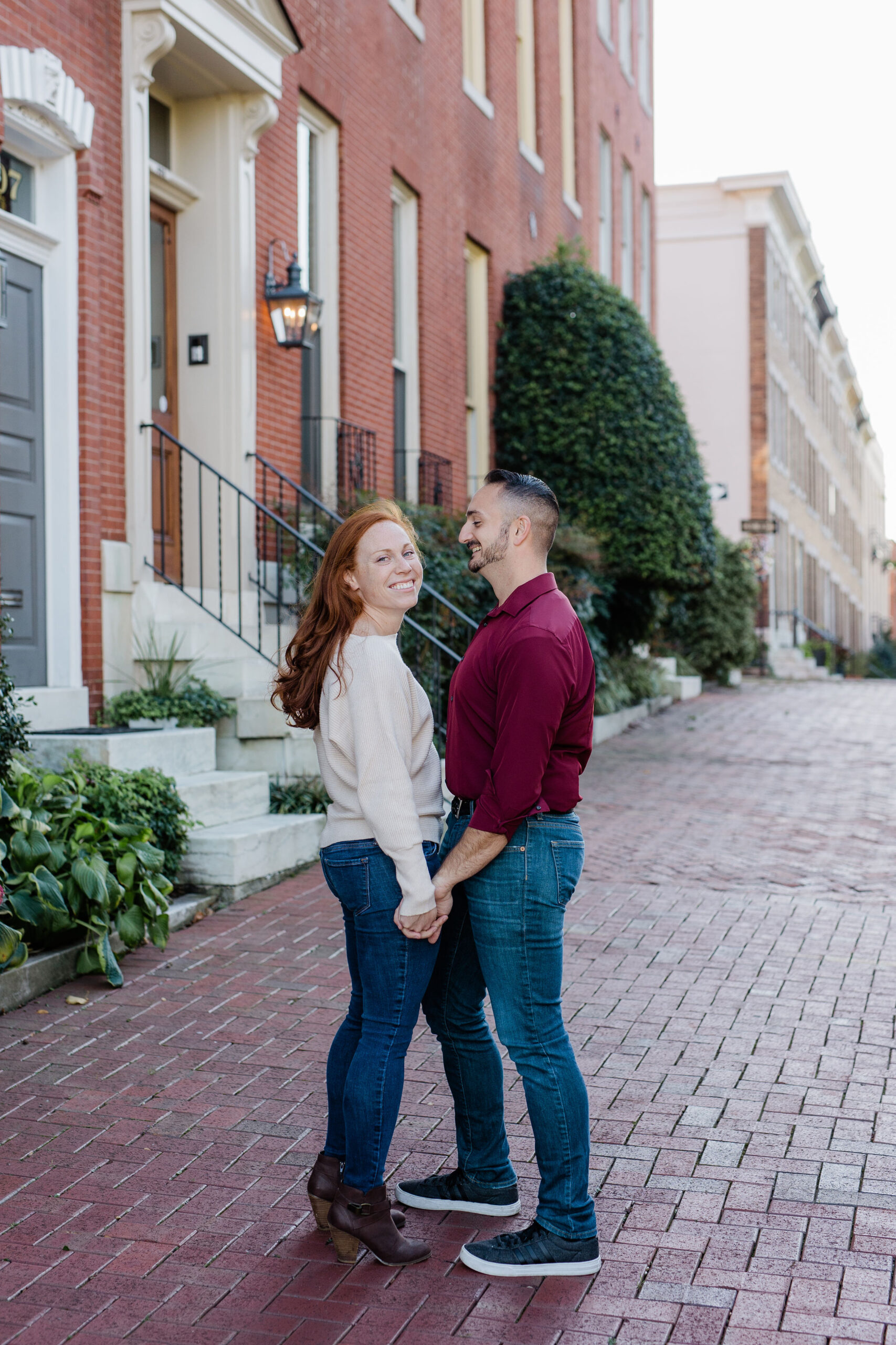 Fells Point engagement photos with cobblestone streets and classic Baltimore row house architecture
