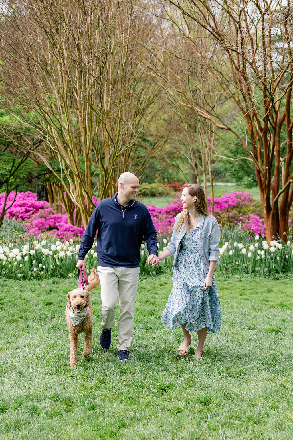 Spring engagement photos with blooming flowers and dog friendly Baltimore photo location inspiration