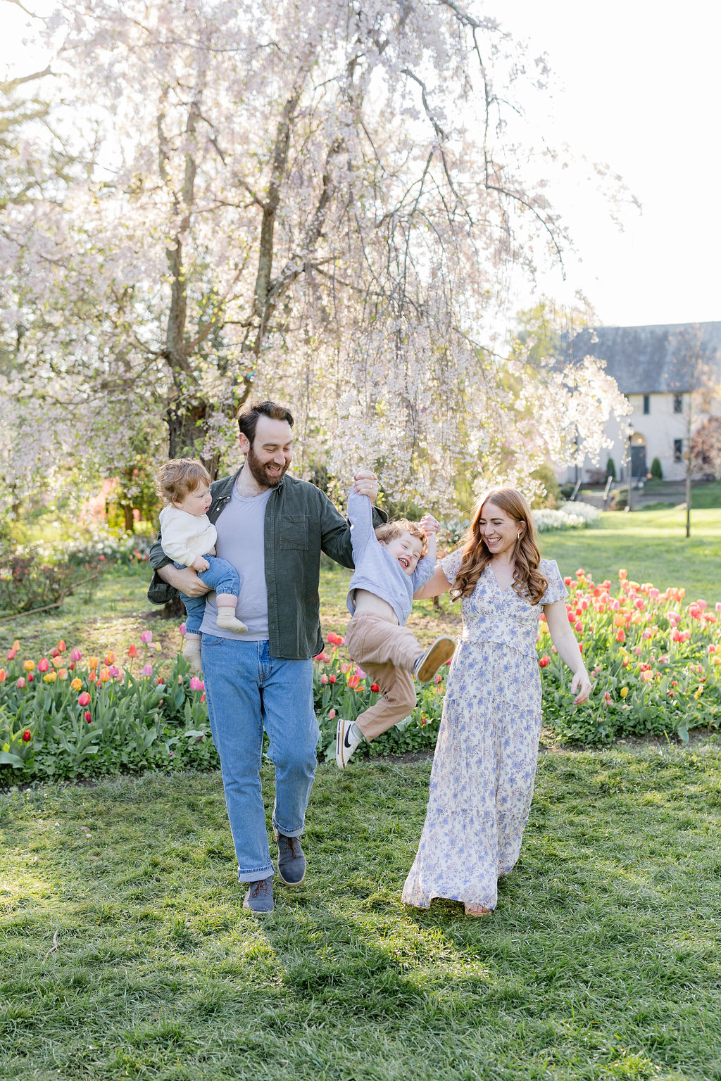 Baltimore Family of 4 playing in the sherwood gardens during a photoshoot