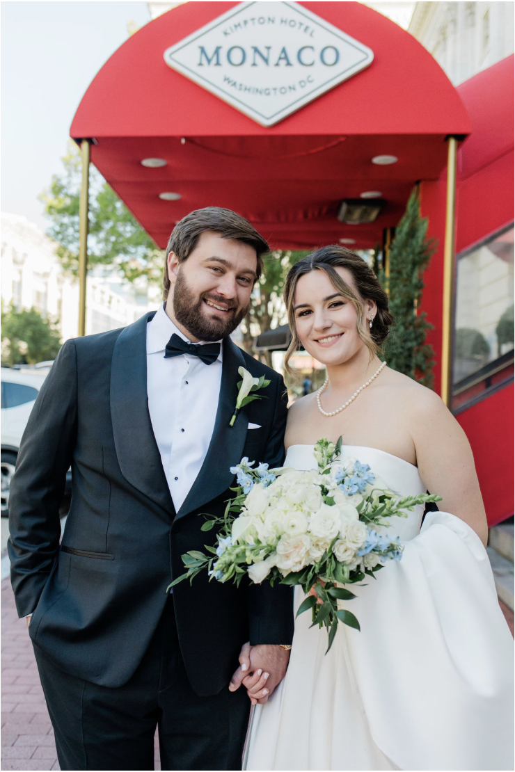 newlywed couple portrait in front of the hotel monaco washington with bouquet and formal attire