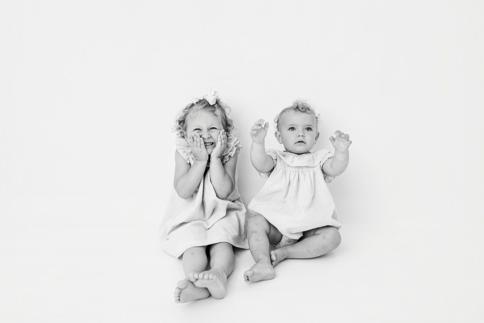 Baltimore children's portrait photographer captures two sisters smiling