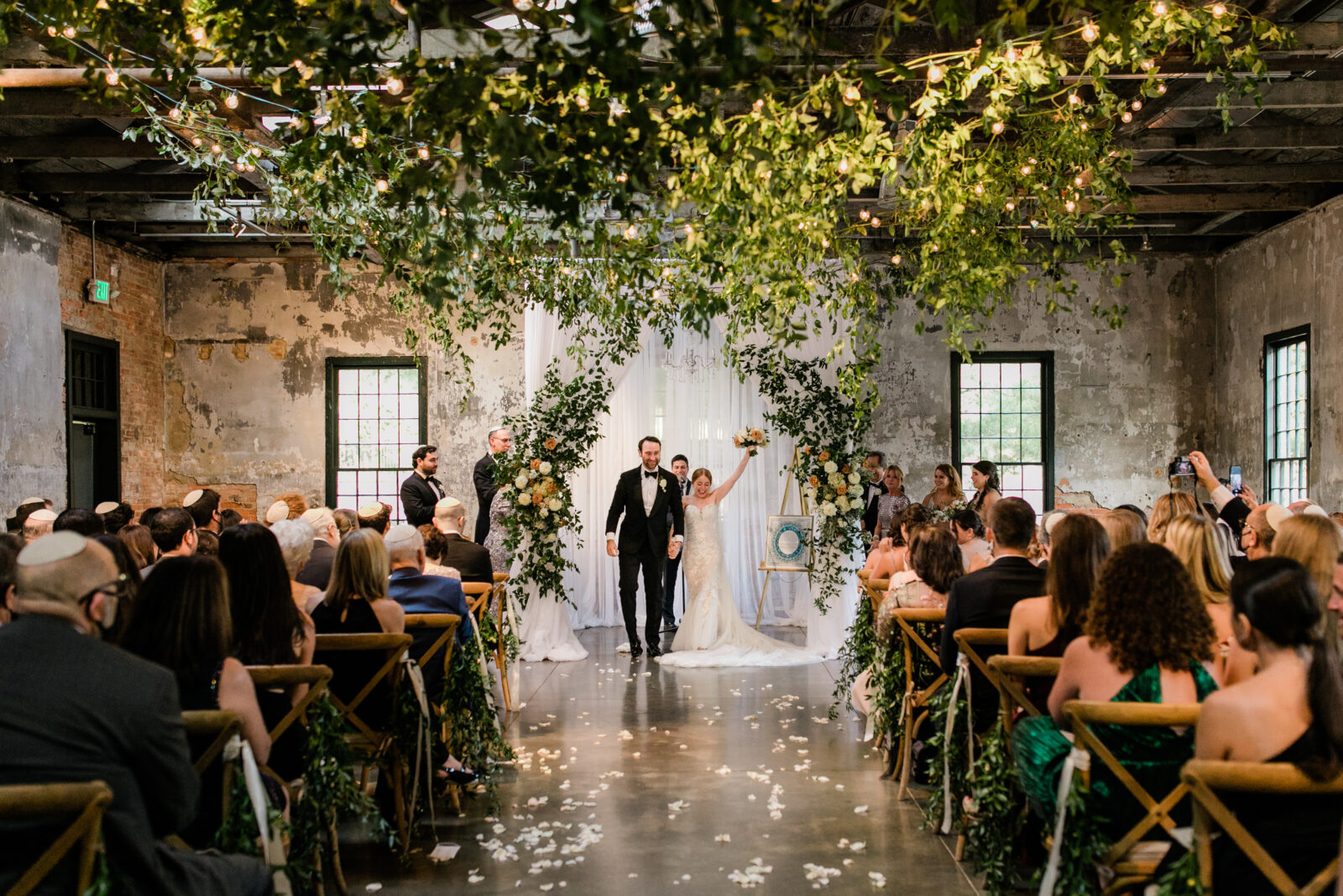 A bride and groom celebrating during their wedding day captured by a Balitmore family photographer.