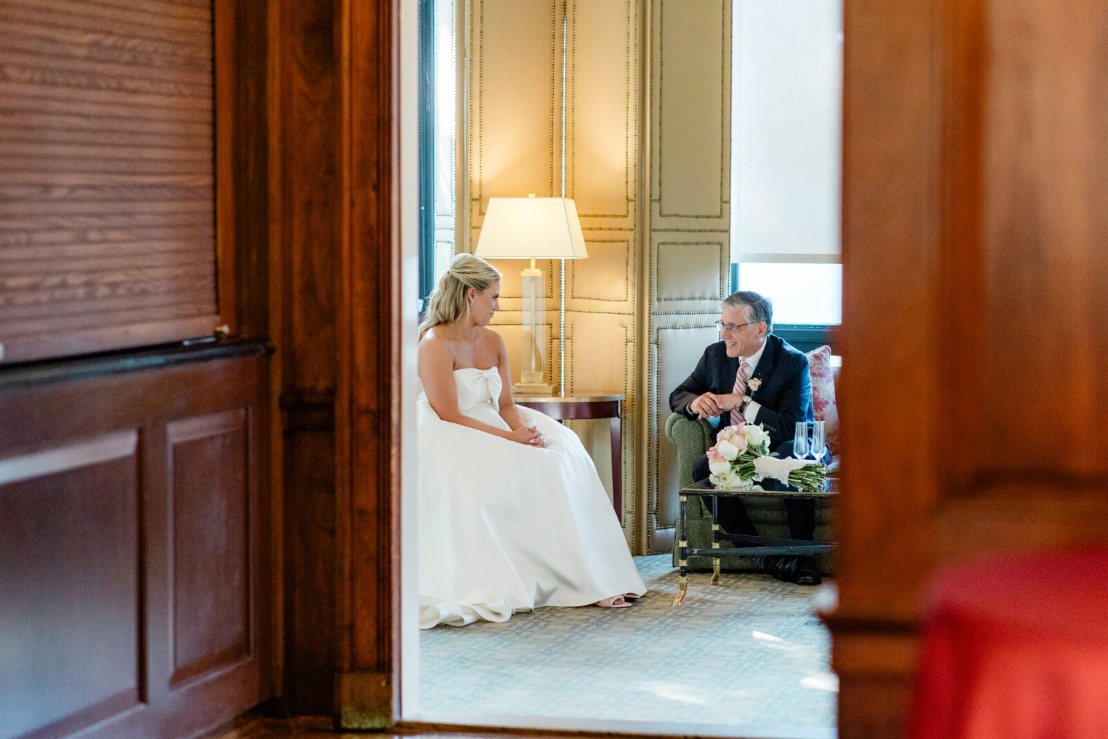 bride and dad sharing a quiet moment before the wedding