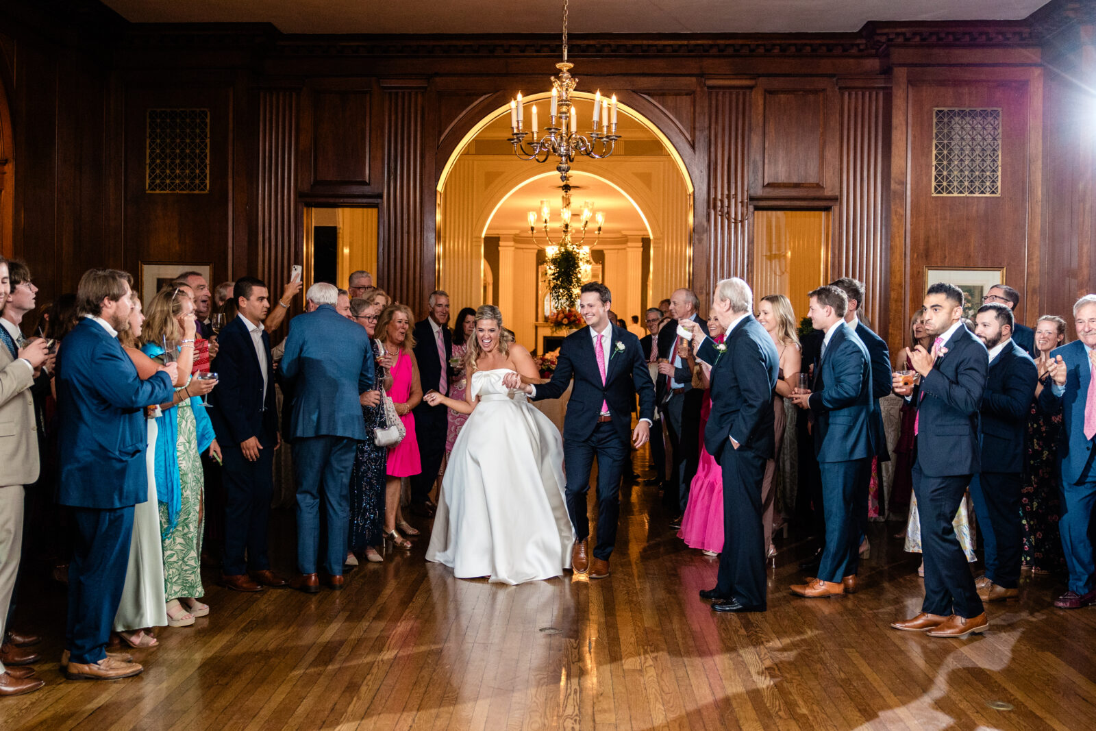 bride and groom making their grand entrance on the dance floor