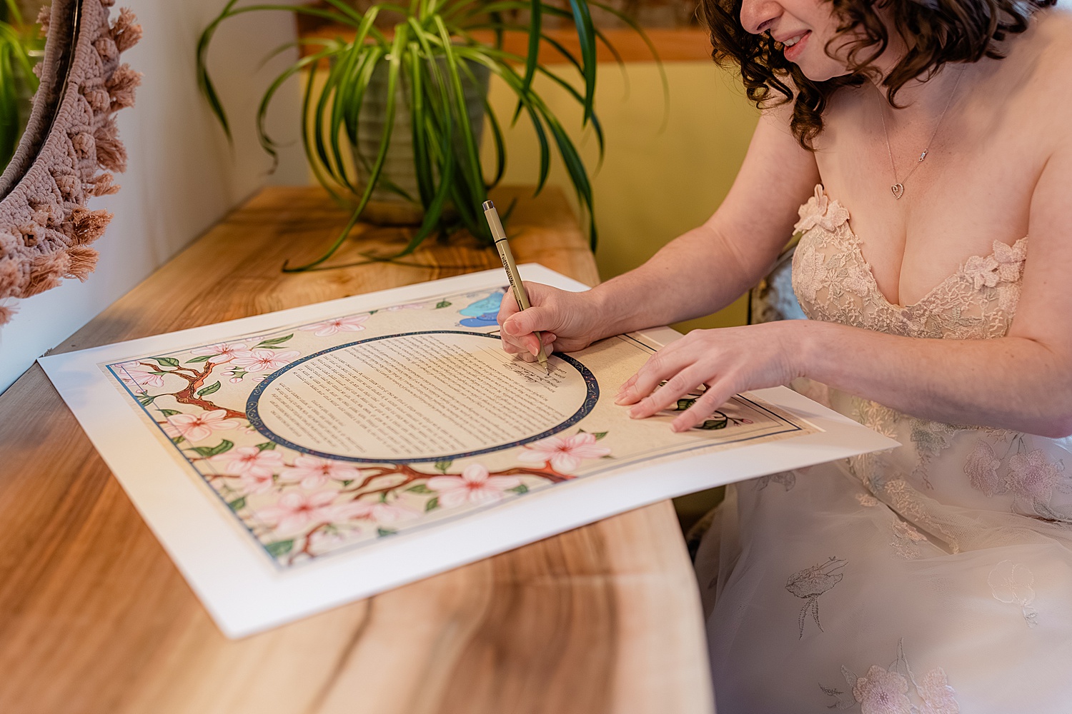 bride signs marital license by Baltimore wedding photographer
