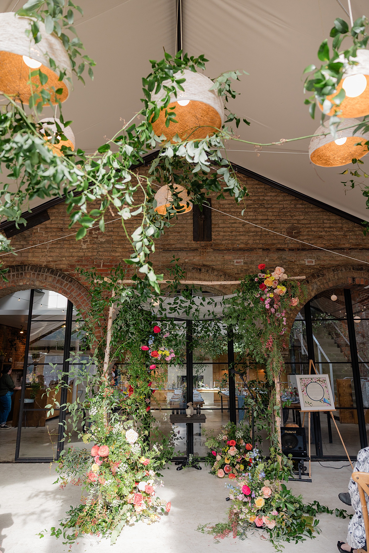 wild flowers all over an indoor arch by Jen Harvey Photography