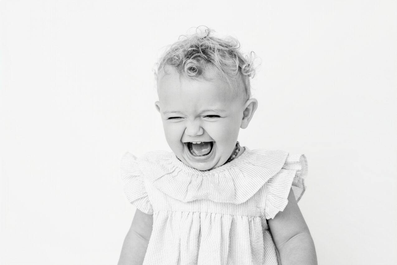 black and white candid photo of a young toddler in a new Baltimore photography studio