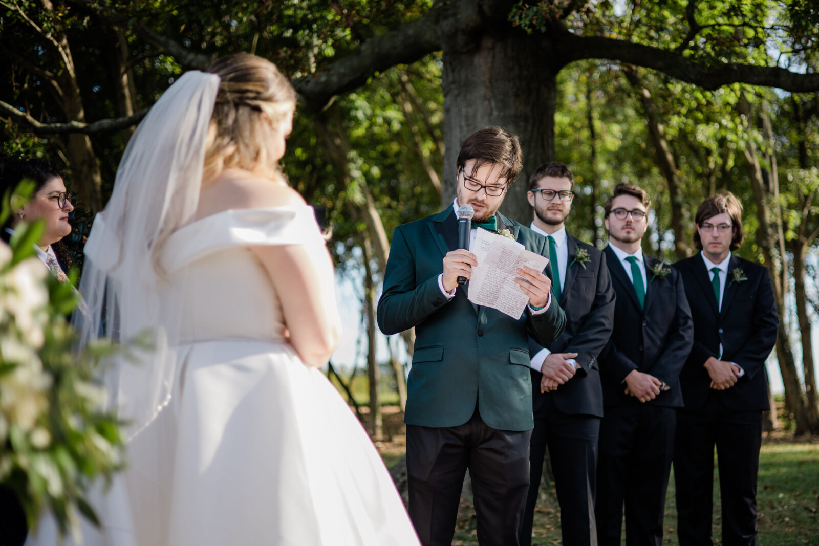 Groom saying his vows at the gazebo wedding