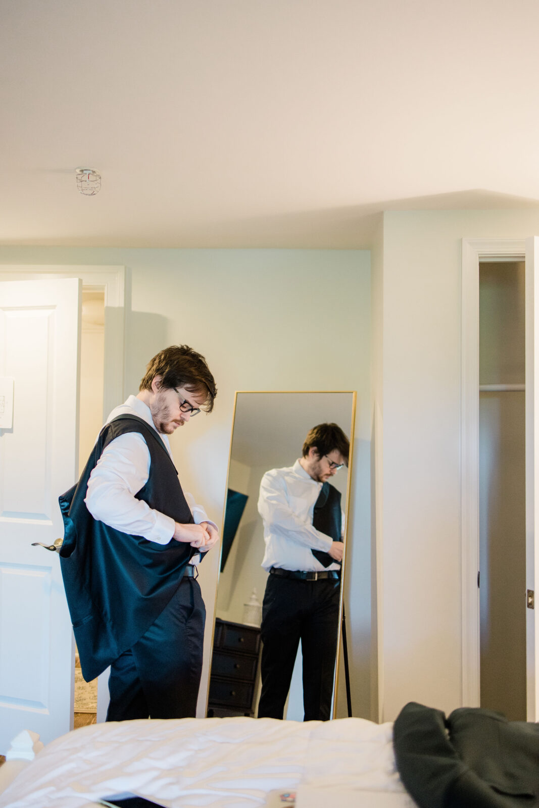 Groom getting ready in the grooms suite at Kent Island Resort