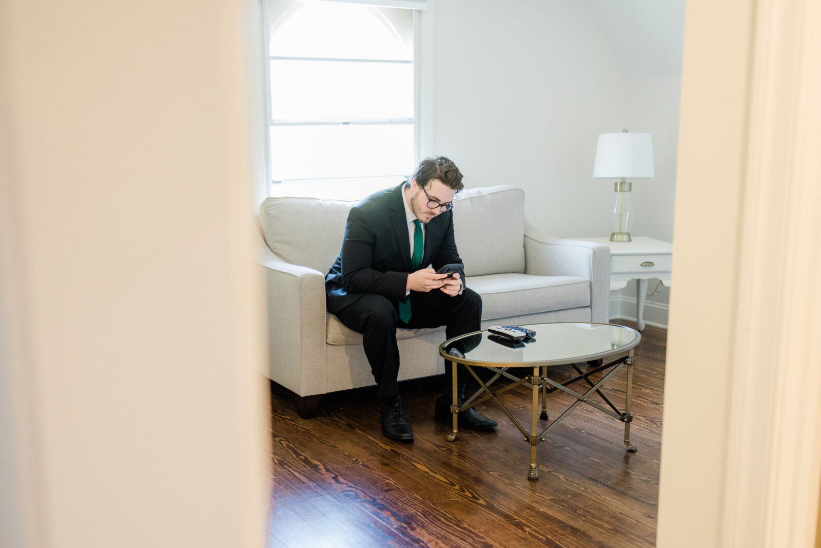 Groom getting ready in the grooms suite at Kent Island Resort