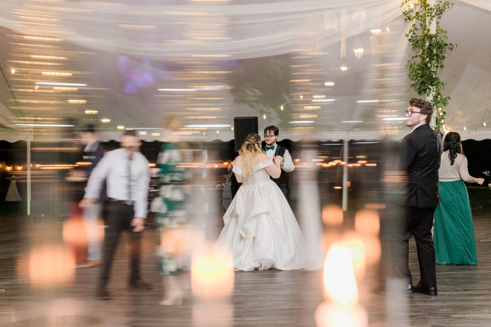 Wedding reception dance floor under string lights inside the Kent Island Resort Pavilion