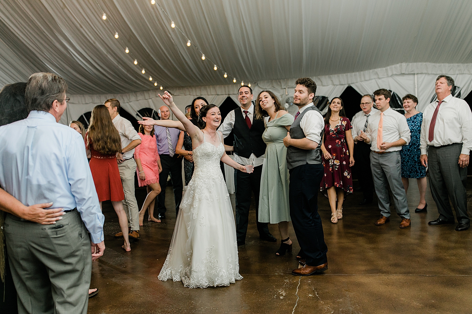 bride dancing with her guests during reception at Chesapeake Inn