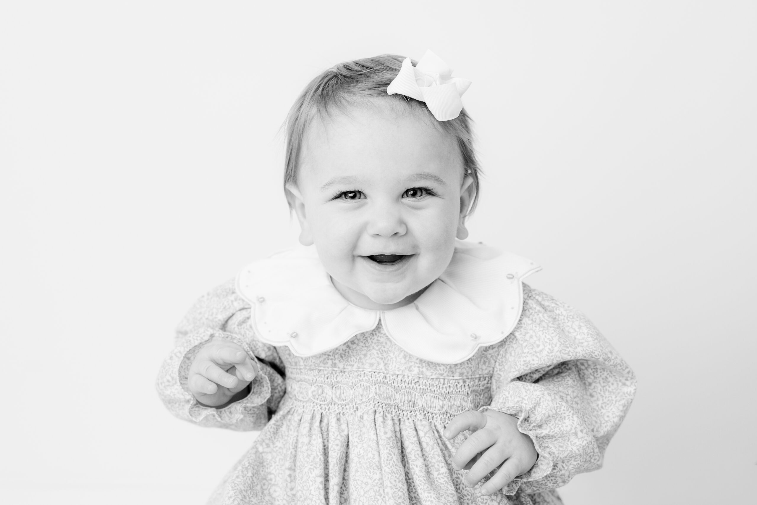 Baltimore children's photographer black and white portrait of a smiling baby girl