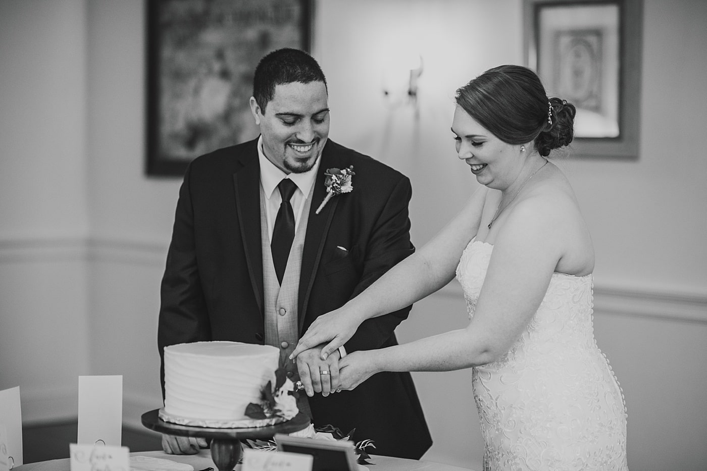 Bride and groom cut their wedding cake