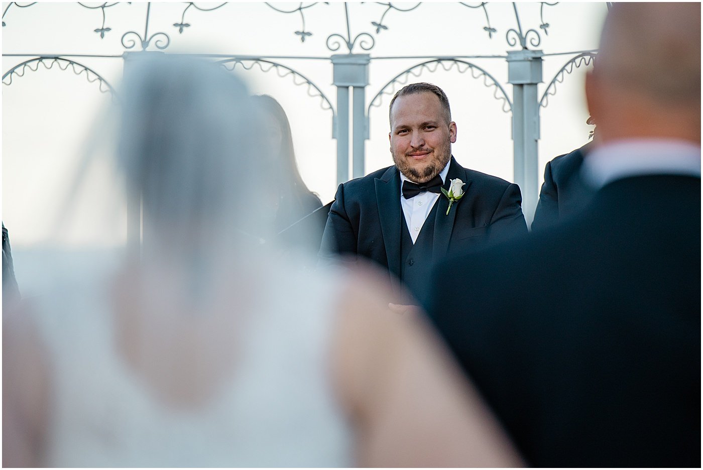 groom sees bride walking down the aisle at Celebrations at the Bay